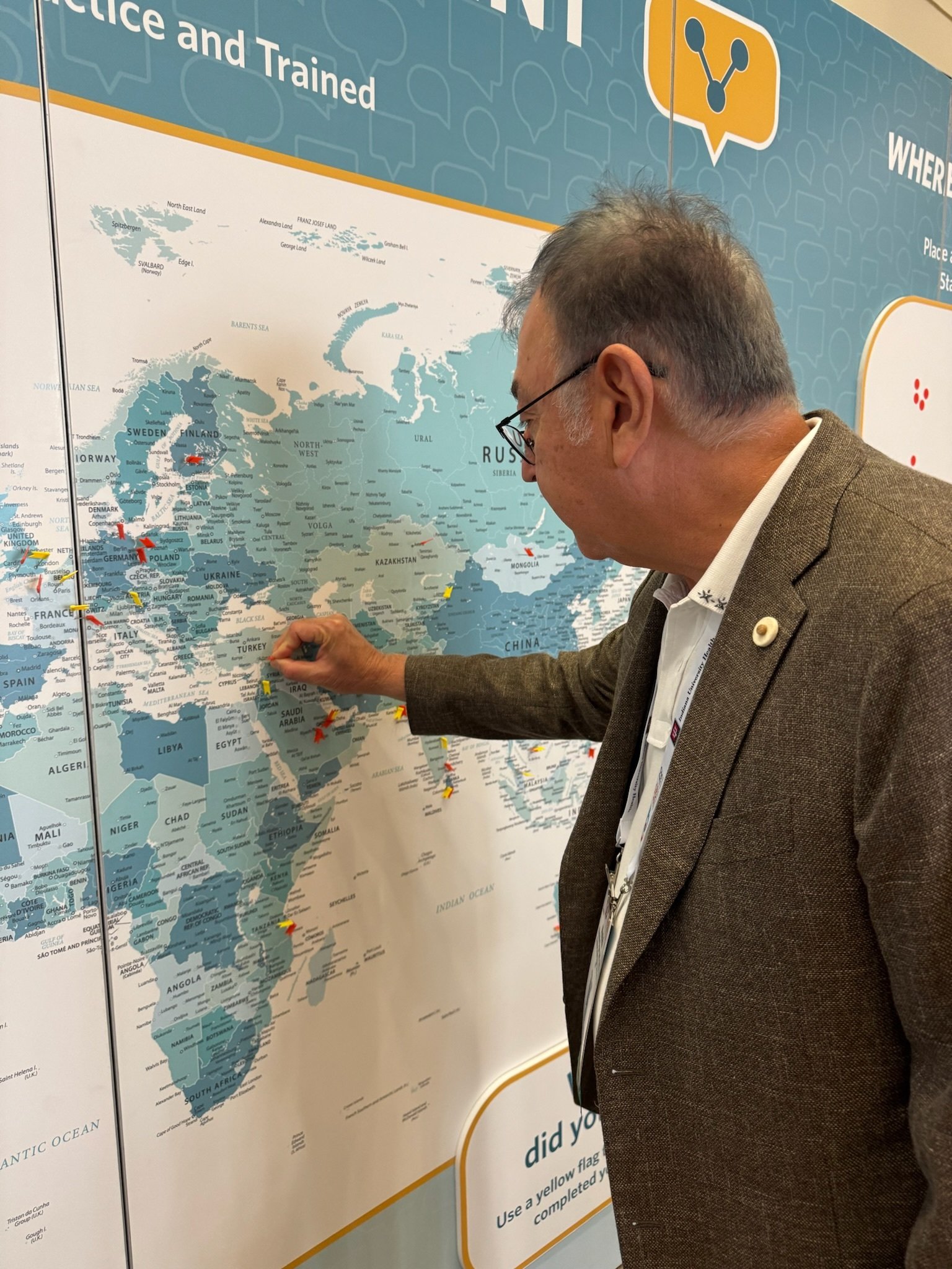 attendee putting a pin on the map
