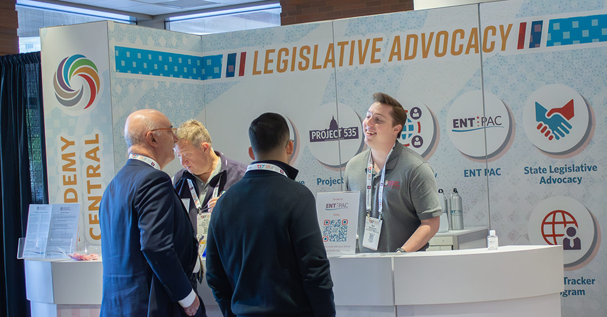 People speaking at Advocacy booth