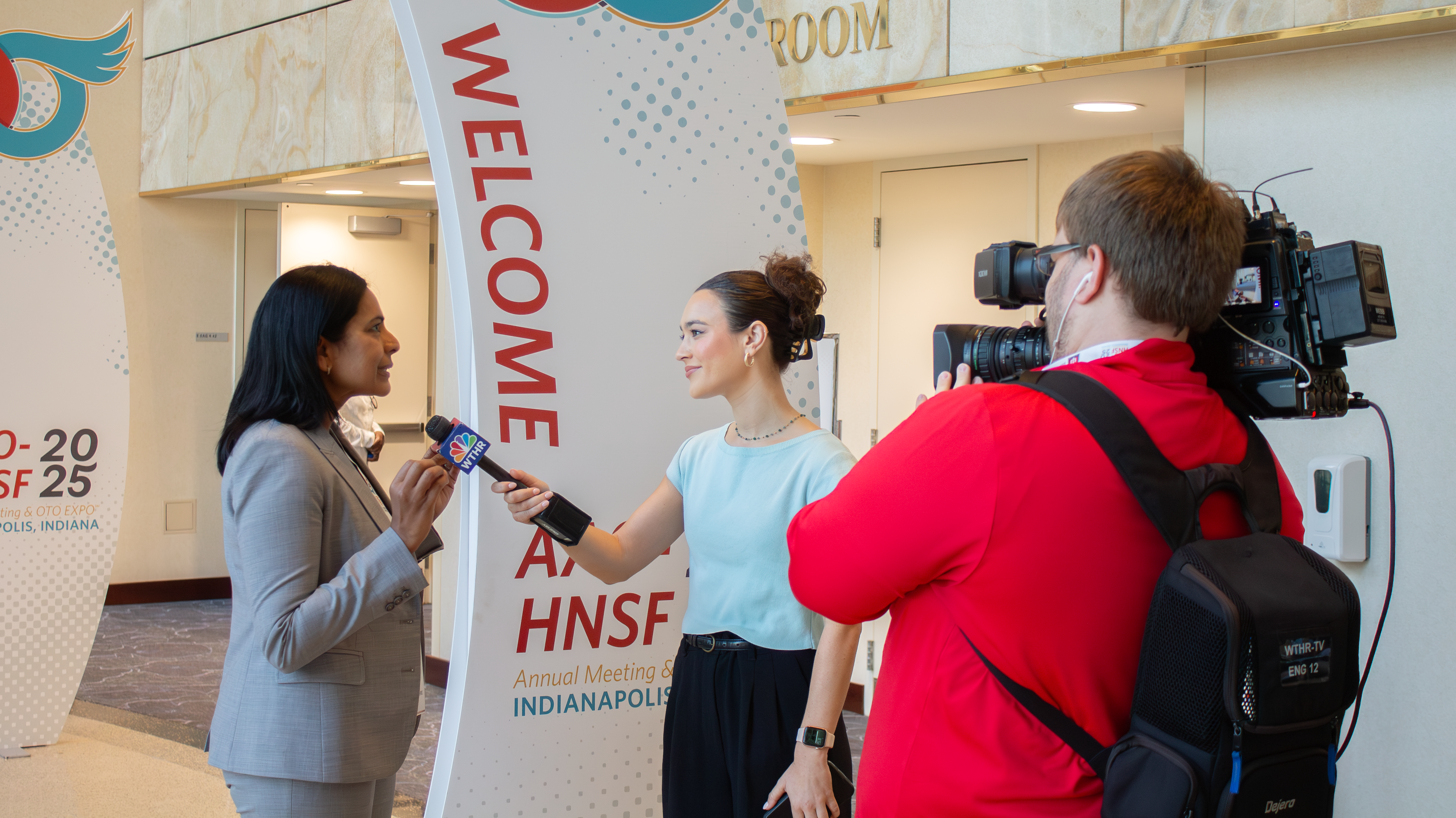Woman being filmed and interviewed for the news