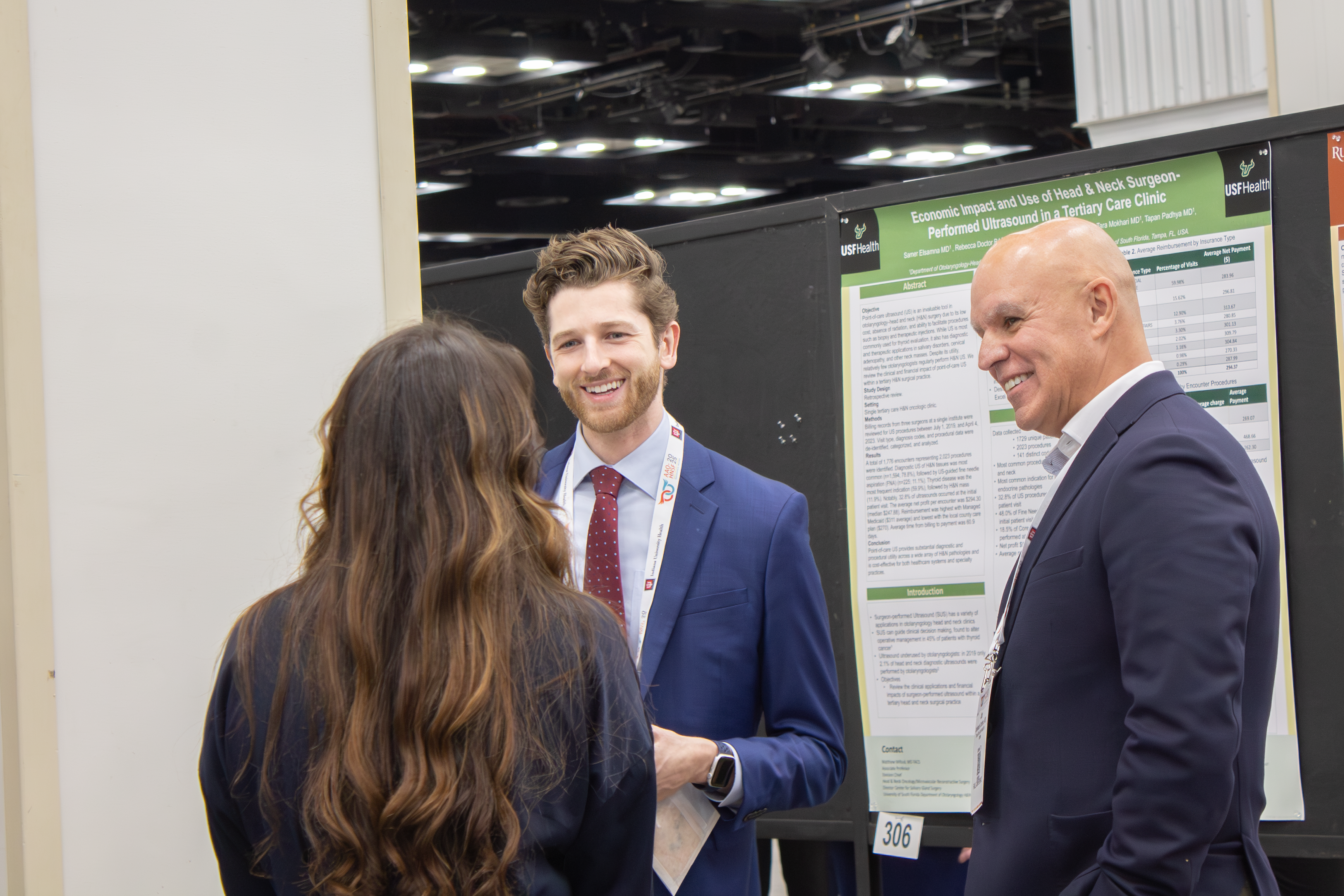 Attendees discussing a scientific poster
