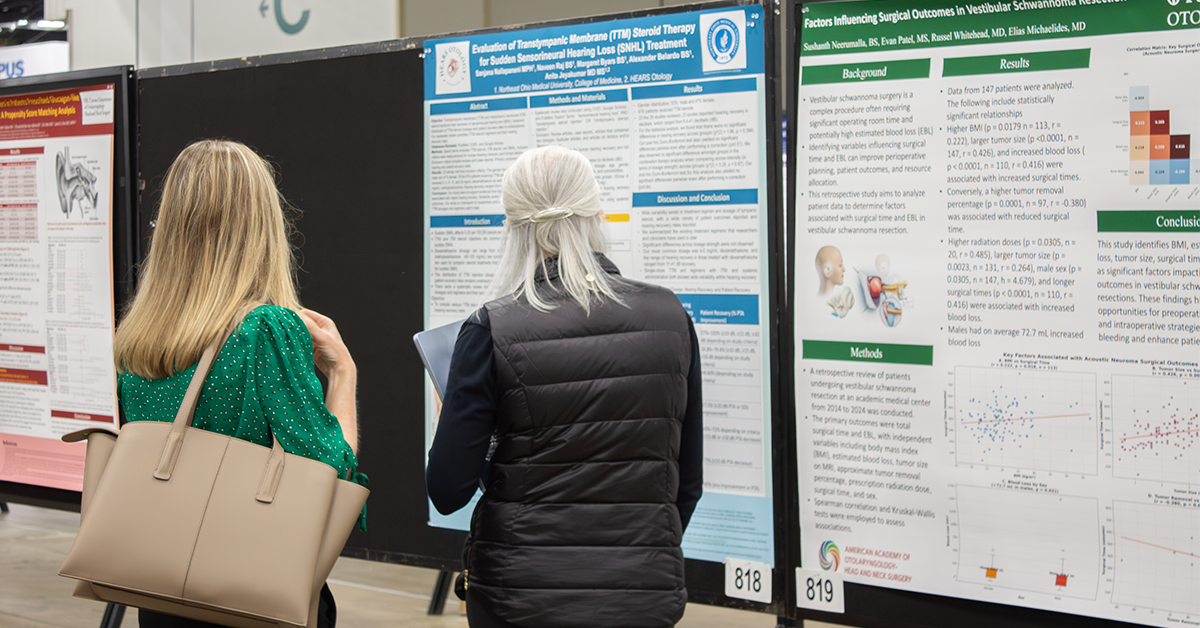 Two women looking at scientific posters