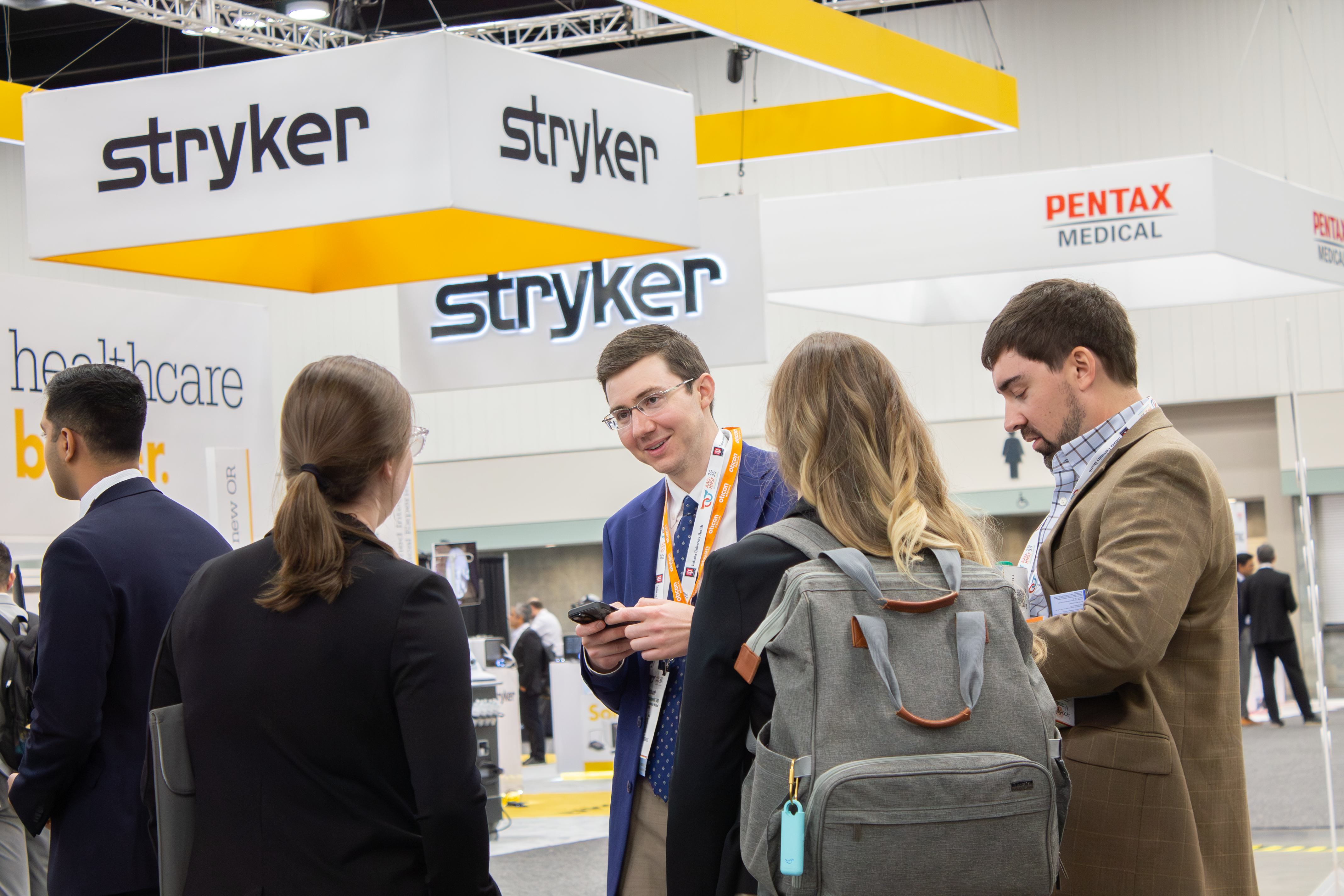 Attendees chatting in the expo hall