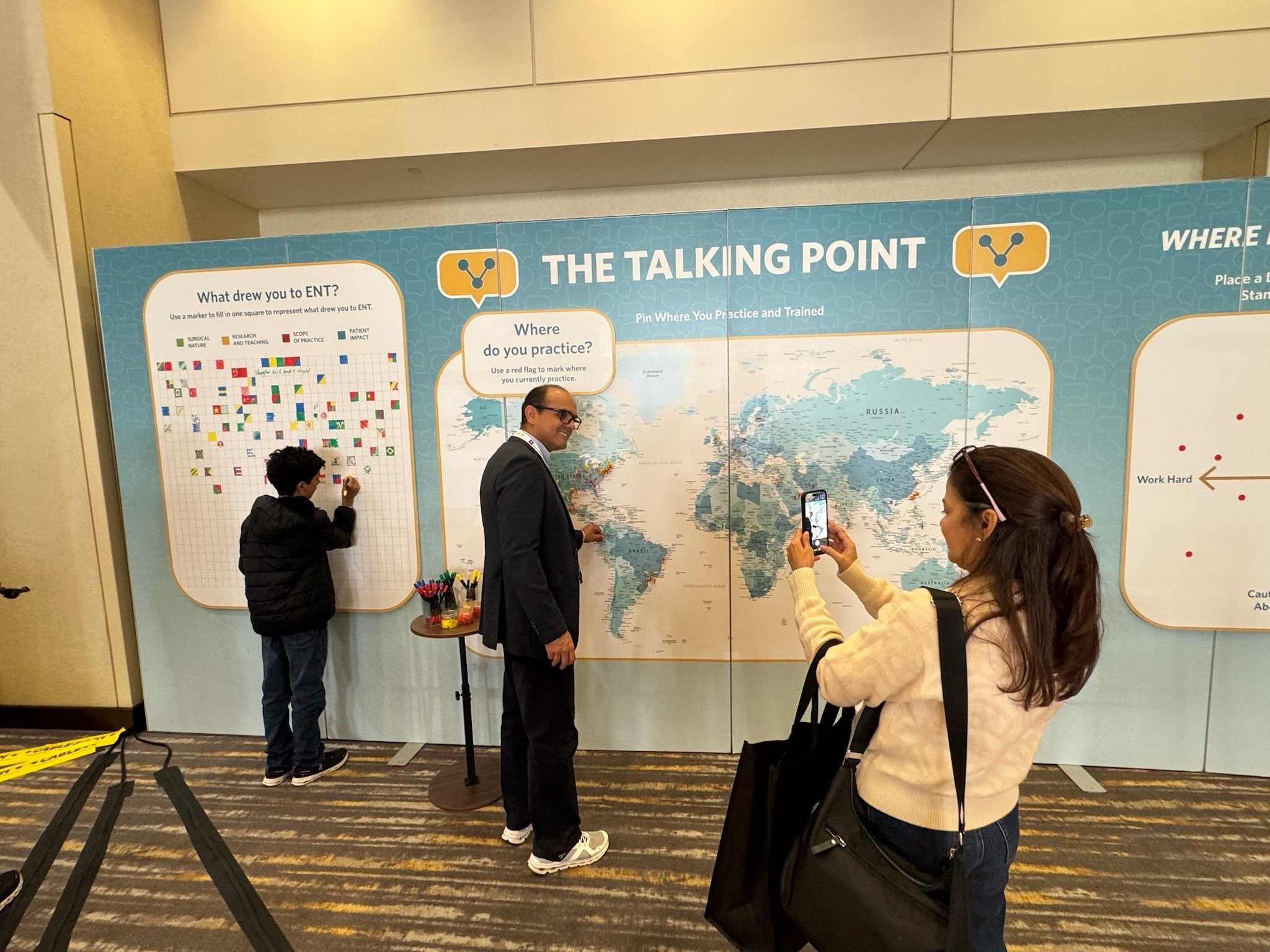 Attendees taking photos at the Talking Point