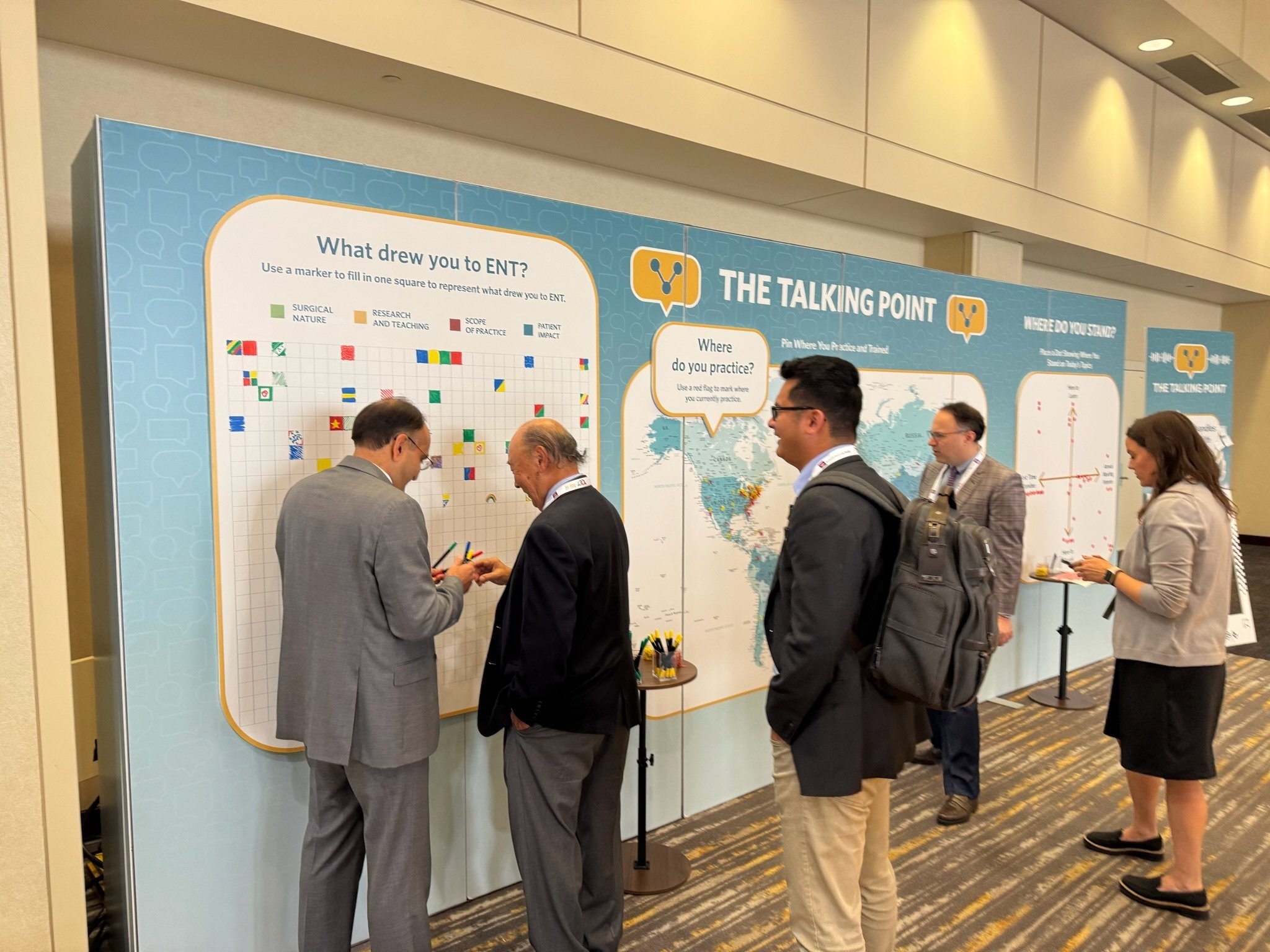 Multiple attendees at the Talking Point participating in activities