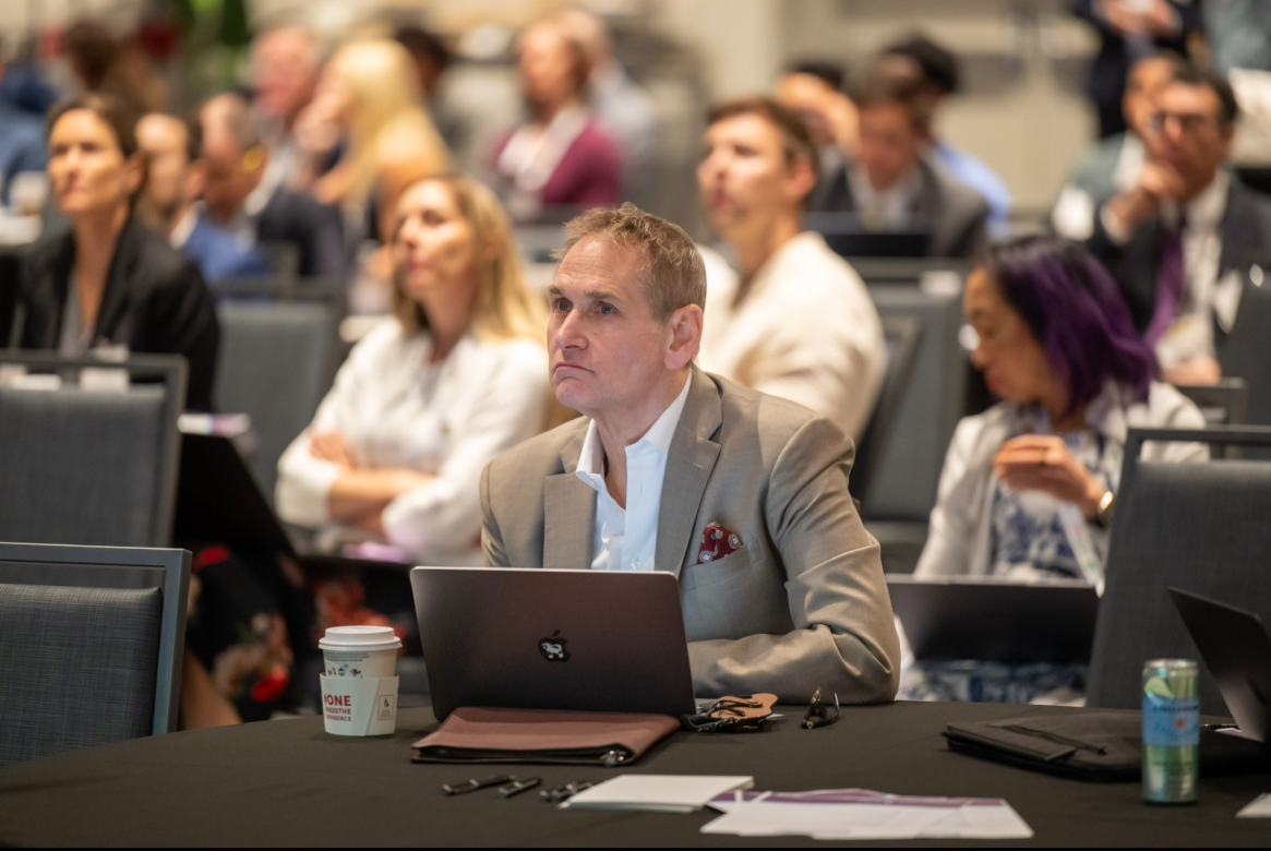 Attendee listening to presentations at the ENT Innovation Connection