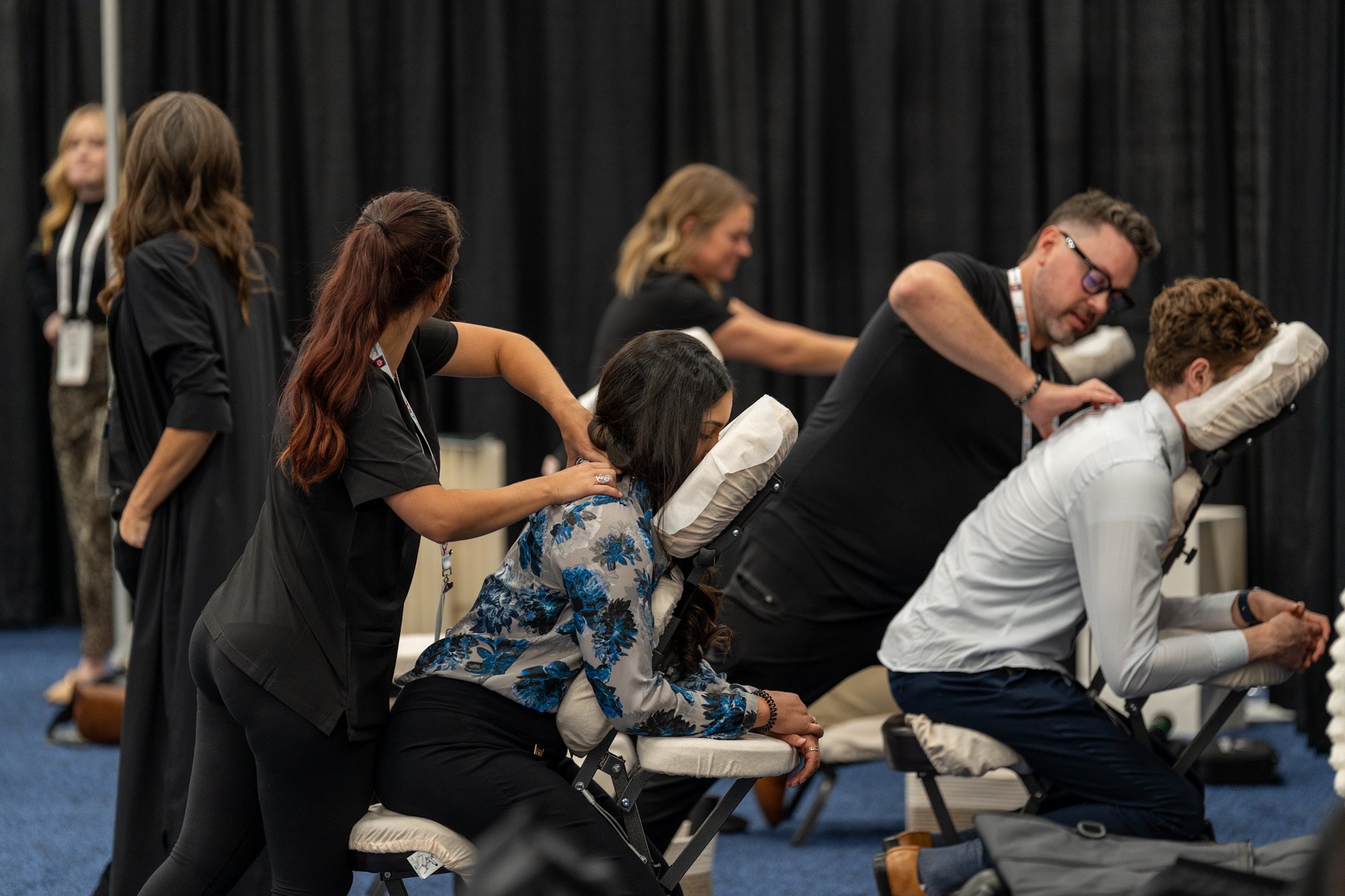 Attendees being massaged at the Wellness Zone
