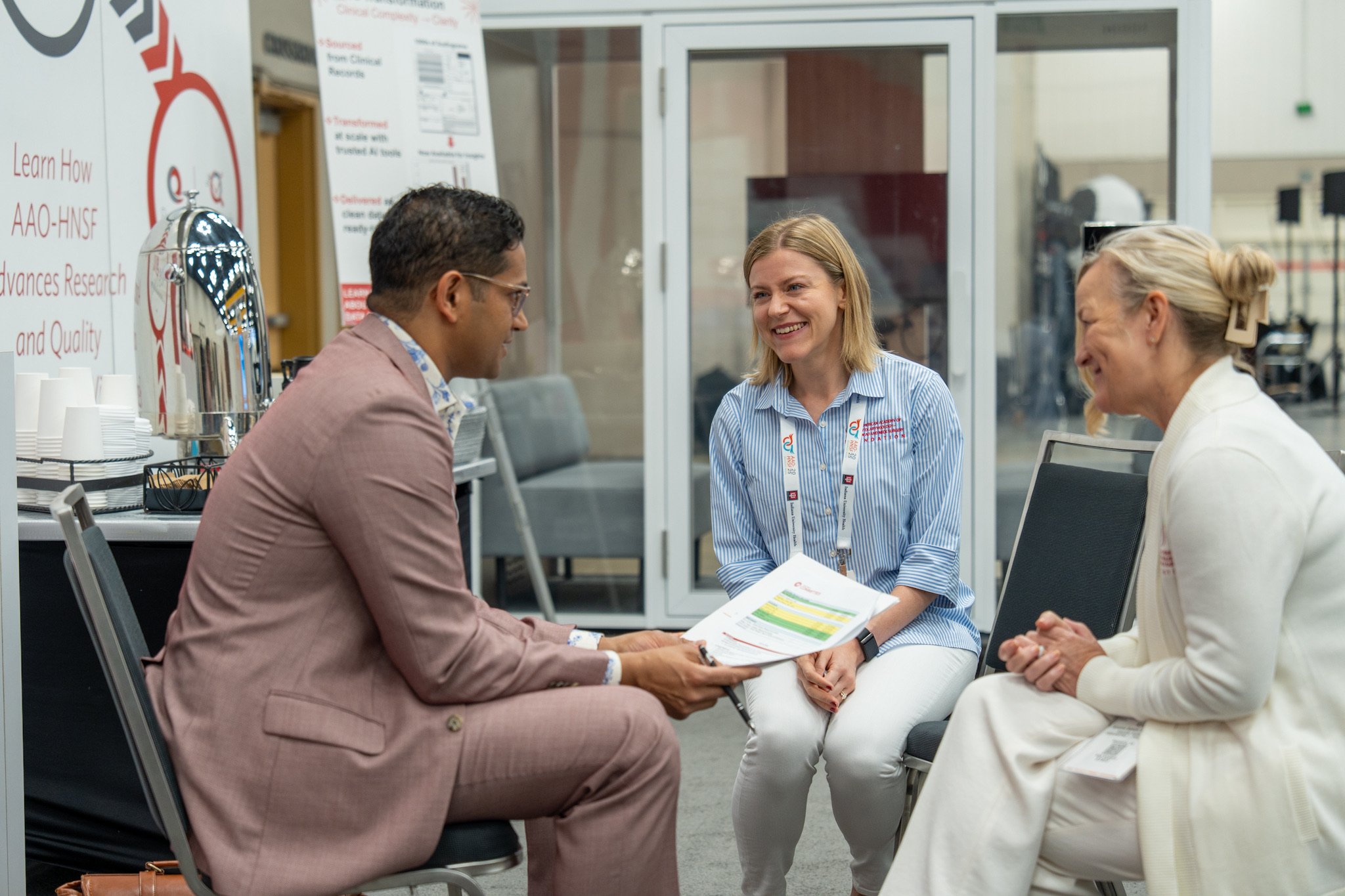 People smiling at the Research and Quality Hub