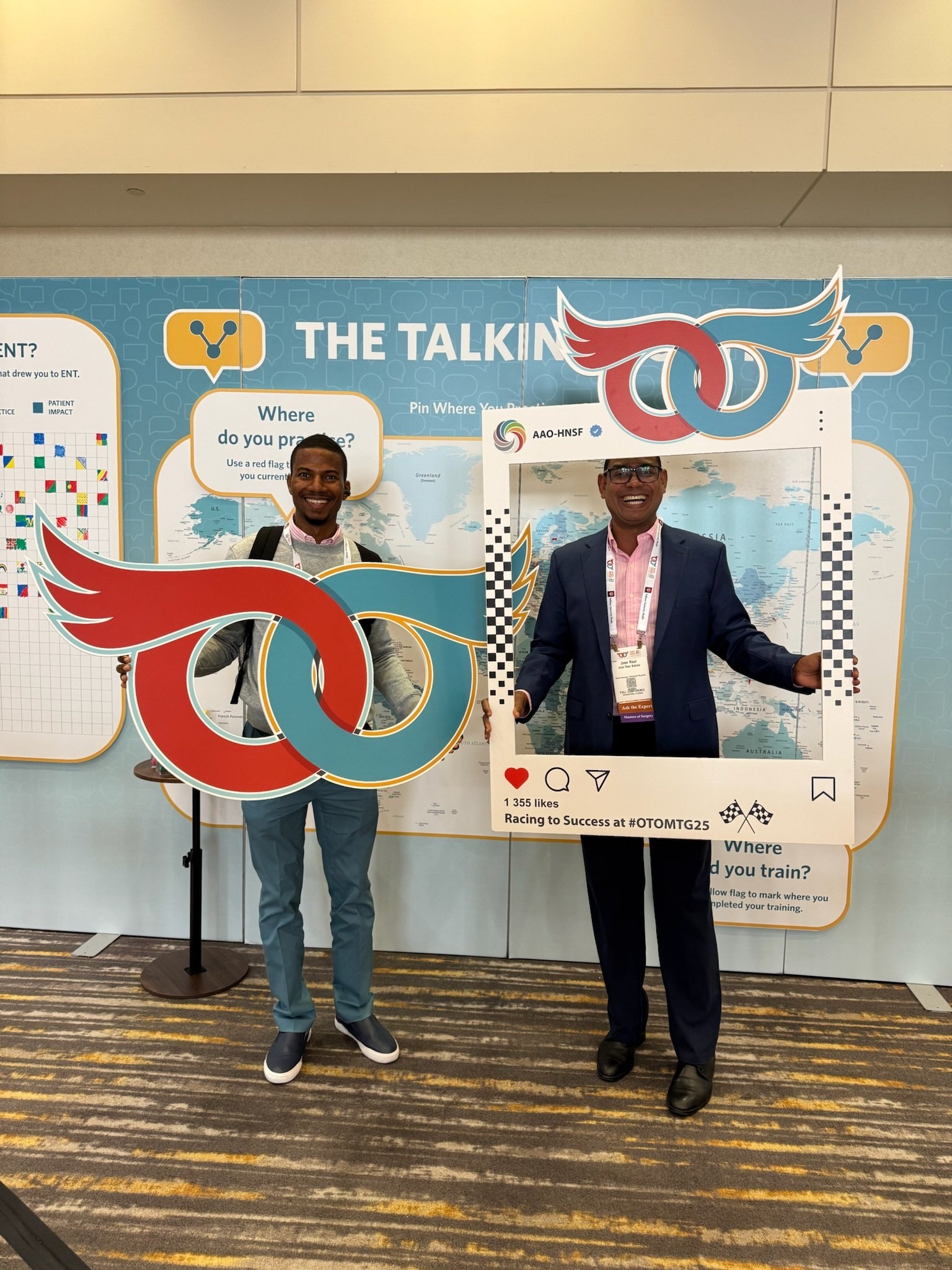Two men holding photo props