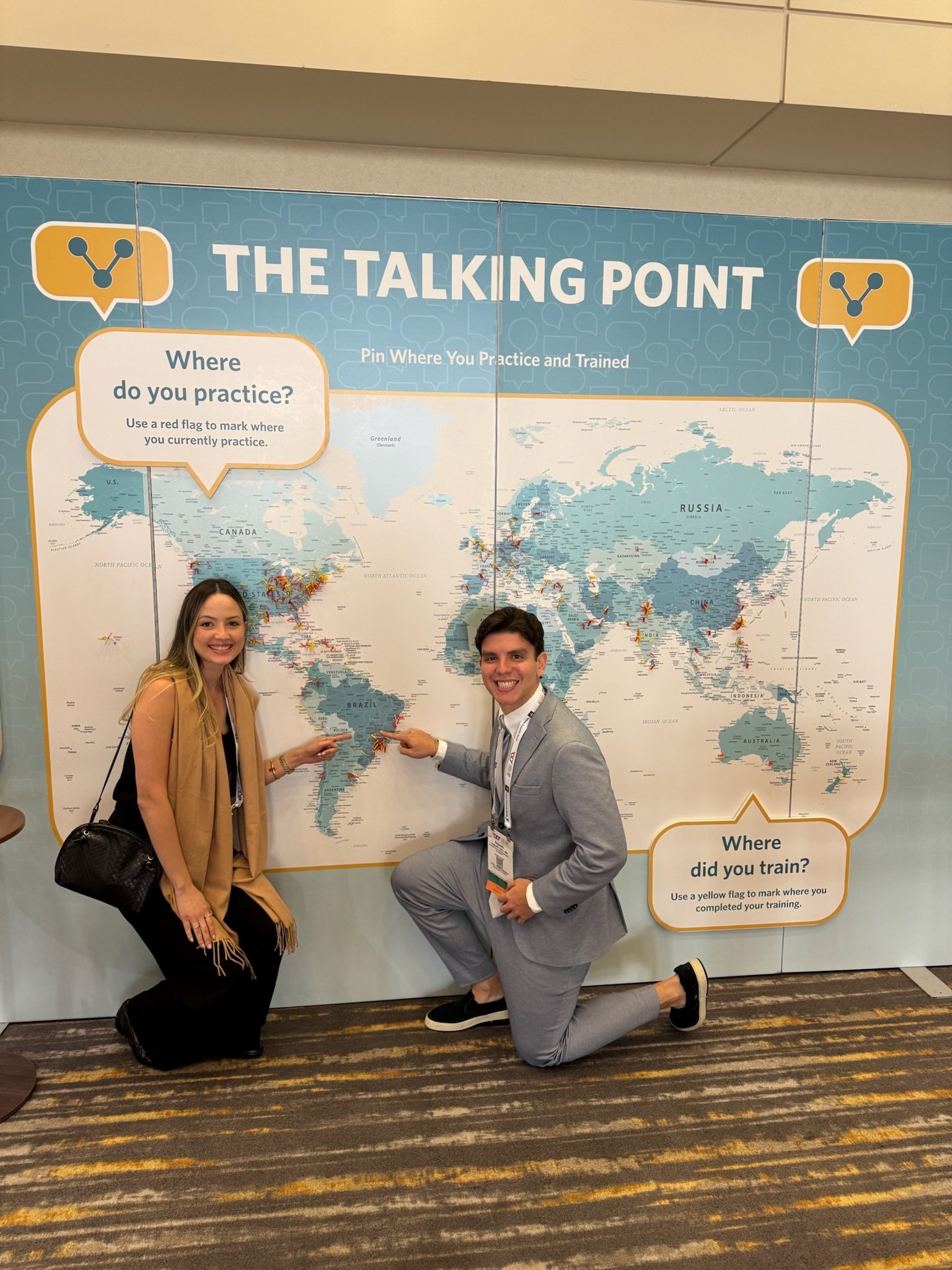 Two attendees adding pins to map