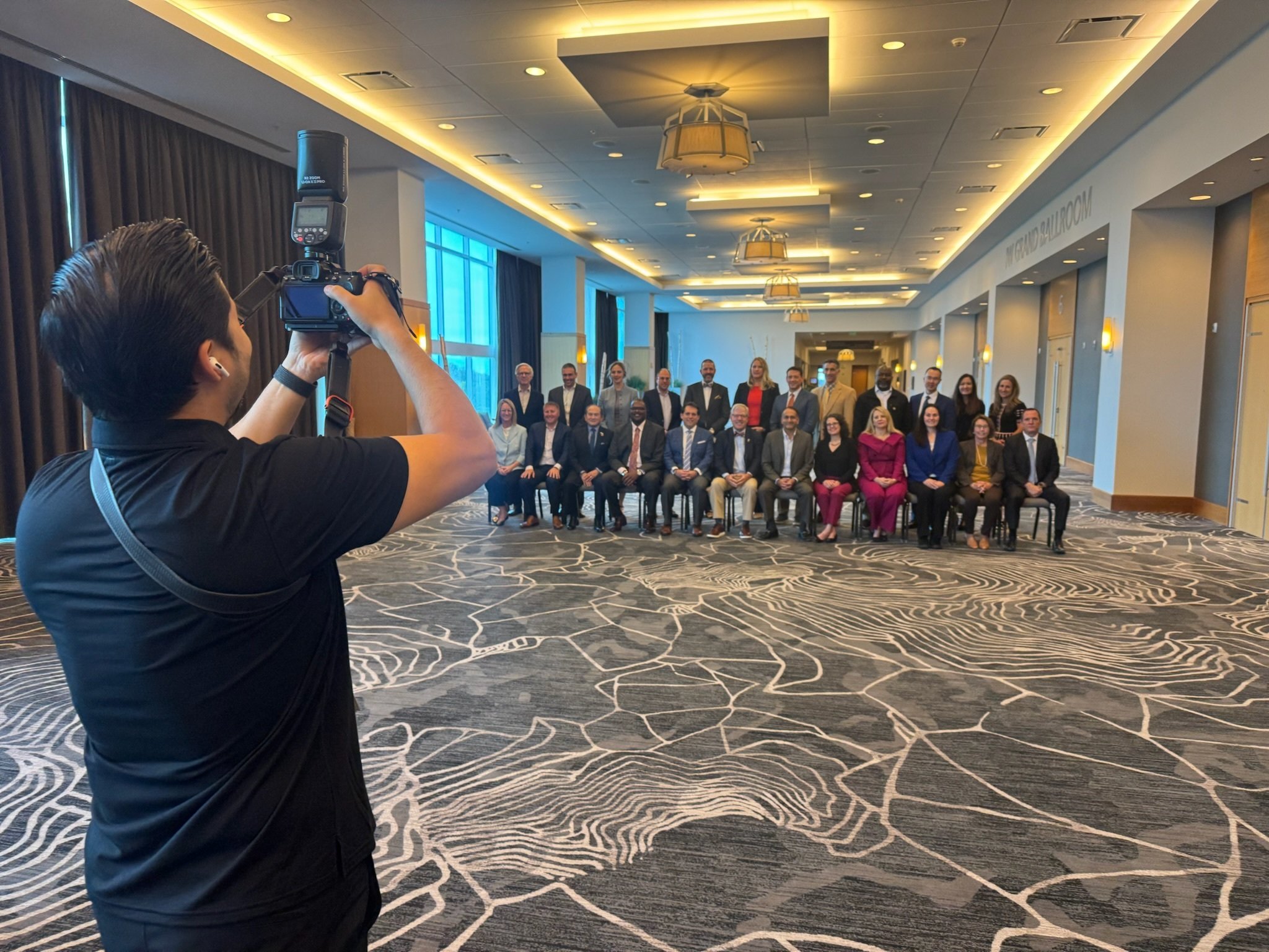 Photo of photographer taking photo of Board of Directors