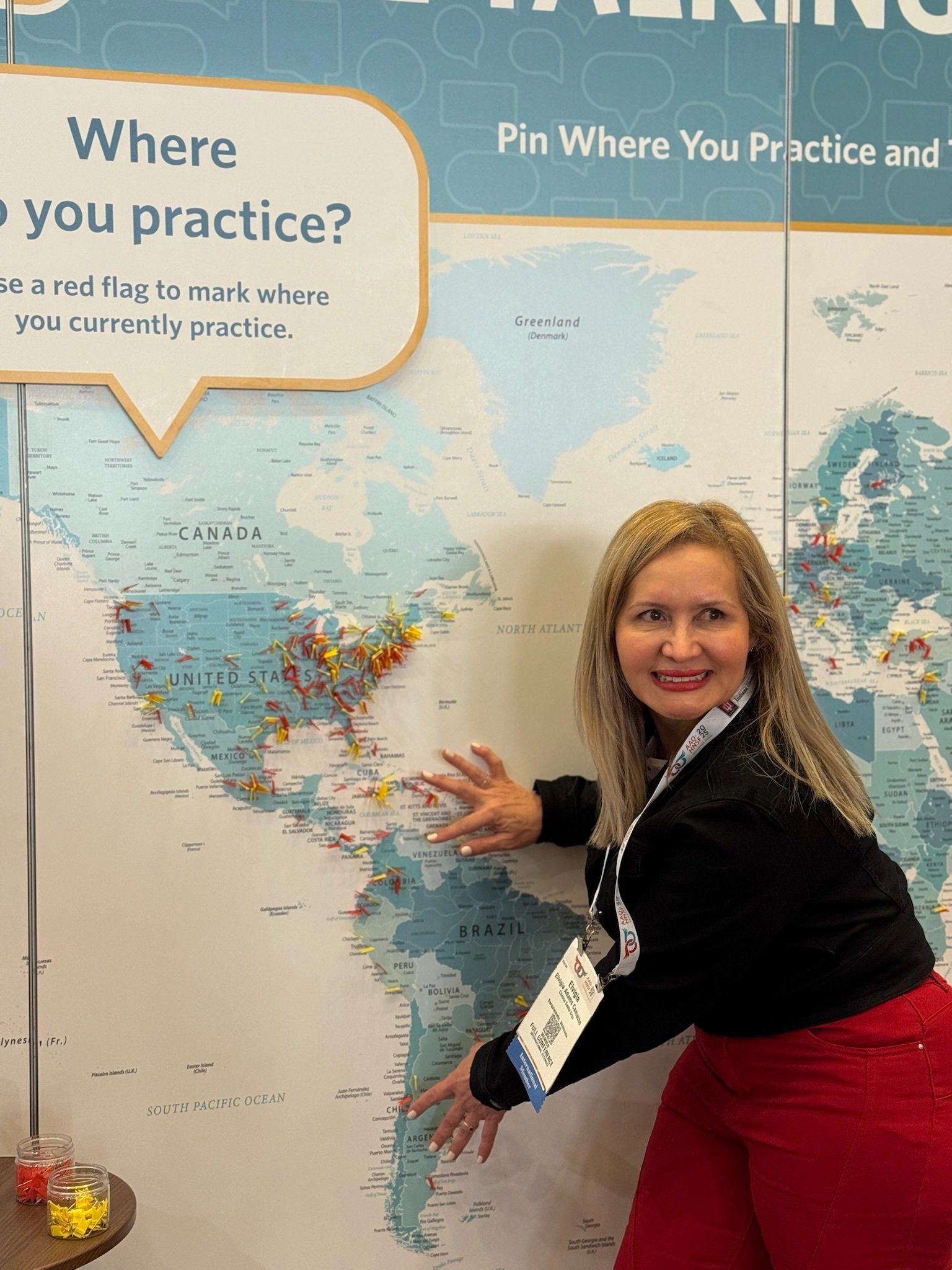 Woman adding pin to map
