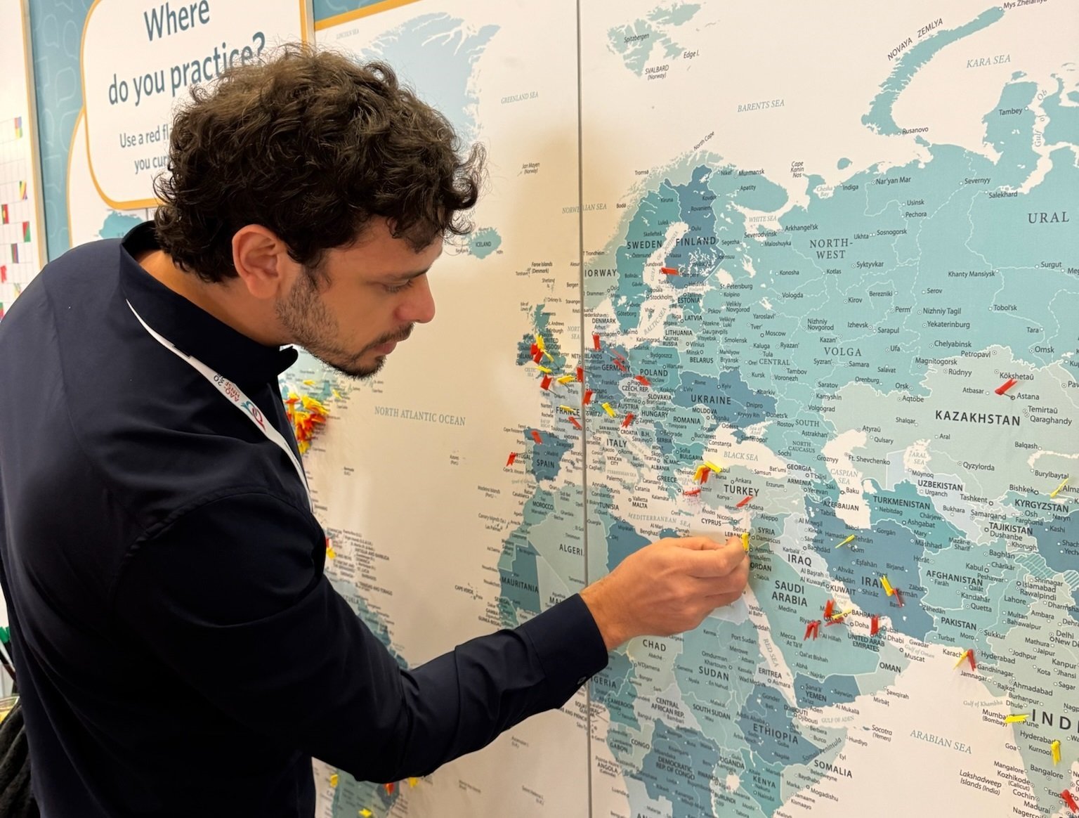 Man putting pin on map at the Talking Point