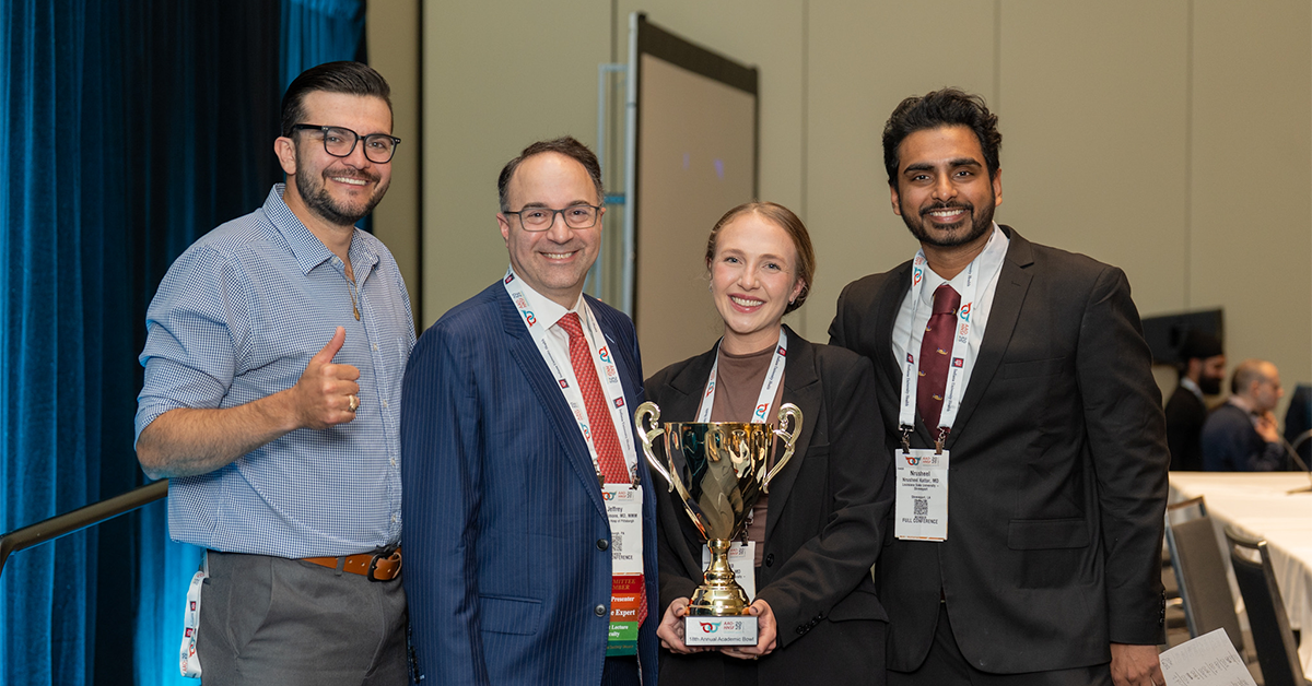 Winners and moderator of the Academic Bowl