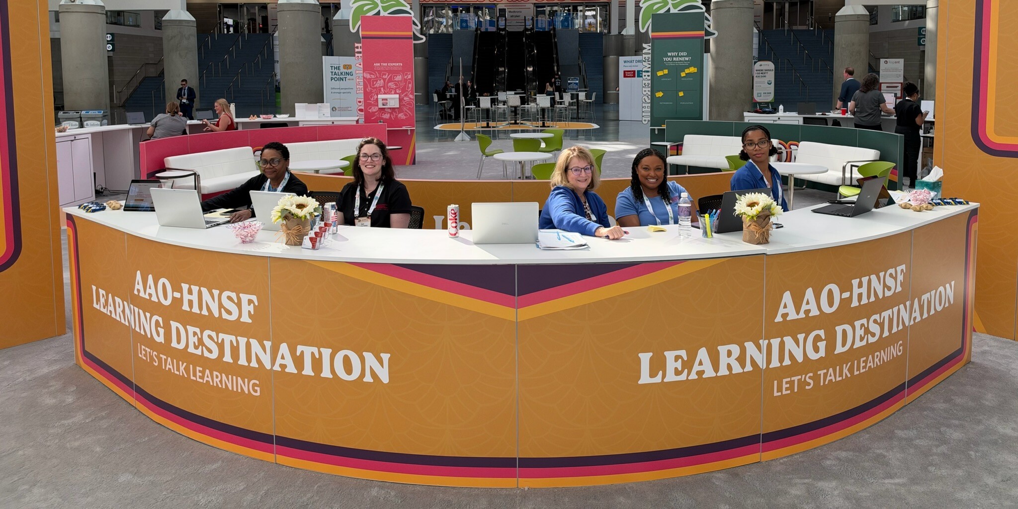 The education team at their booth at Academy Central. 